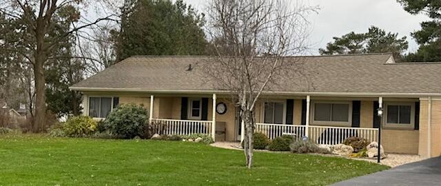 view of front of property with a front lawn and a porch