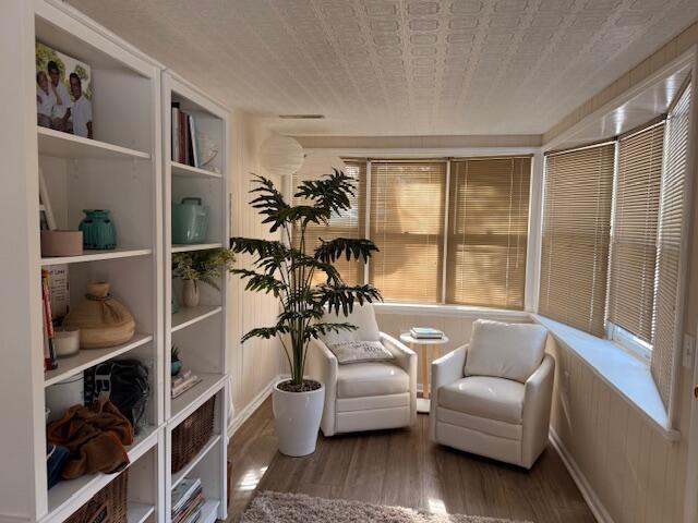 sitting room with dark hardwood / wood-style flooring