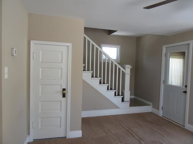 foyer with light carpet