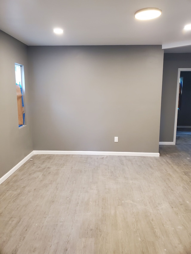 spare room featuring light hardwood / wood-style floors