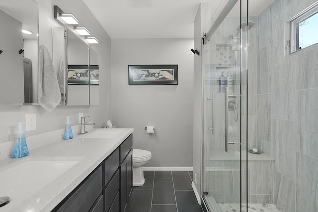 bathroom with tile patterned floors, toilet, an enclosed shower, and vanity