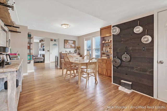 dining space with light wood-type flooring