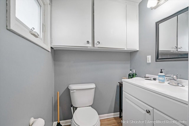 bathroom with toilet and vanity