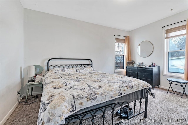 bedroom featuring carpet flooring and multiple windows