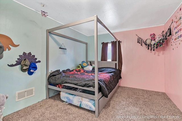 carpeted bedroom featuring ornamental molding