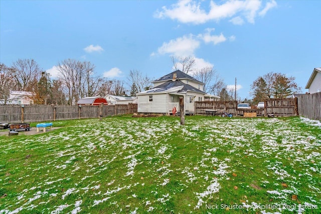 view of yard layered in snow