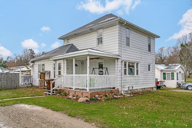 view of front of house featuring a front yard and a porch