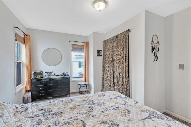 carpeted bedroom with baseboards