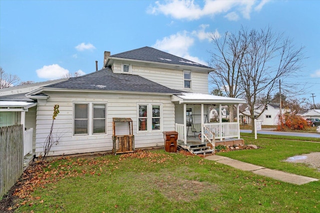 view of front of property with a porch, roof with shingles, and a chimney
