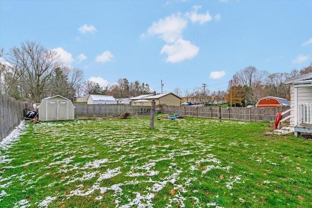 view of yard with a storage unit and an outbuilding