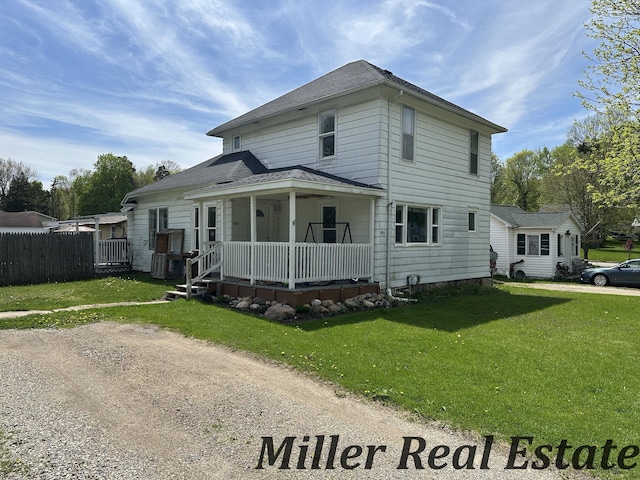 604 E Hubble St, Hastings, MI 49058 - traditional-style house with a porch and a shingled roof