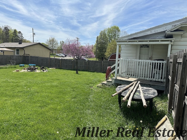 view of yard with an outdoor fire pit