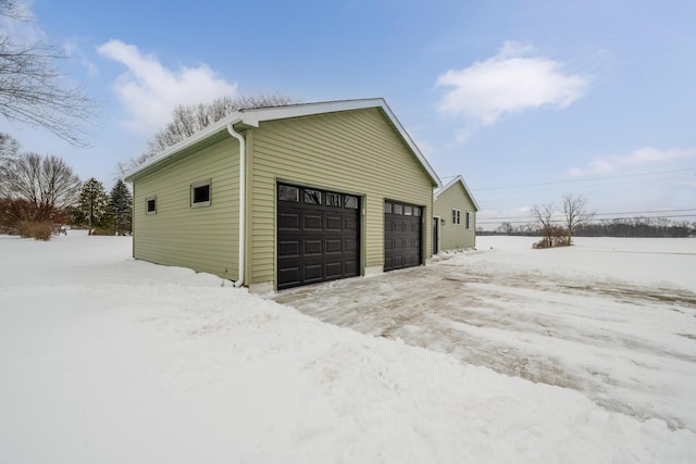 view of snow covered garage