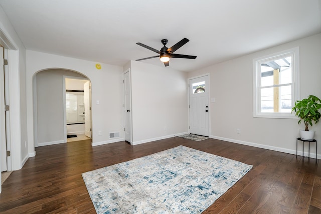 entrance foyer featuring ceiling fan and dark wood-type flooring