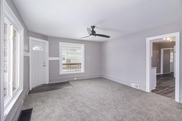 interior space featuring ceiling fan