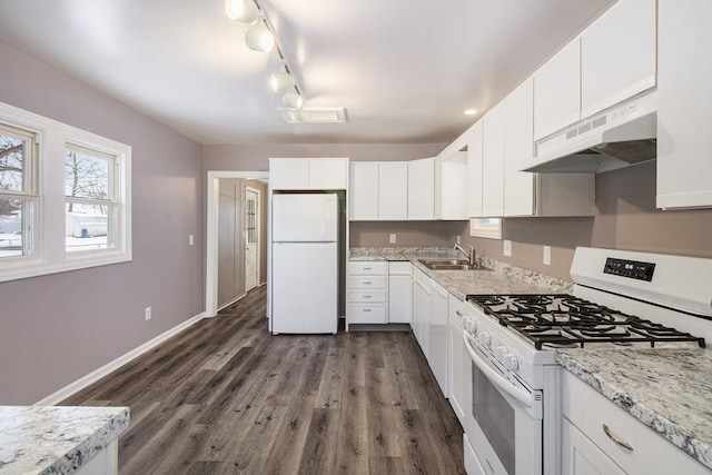 kitchen featuring white cabinetry and white appliances