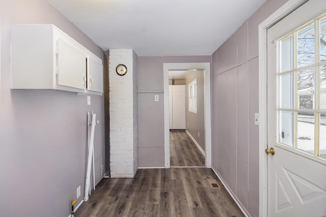 corridor featuring dark hardwood / wood-style flooring