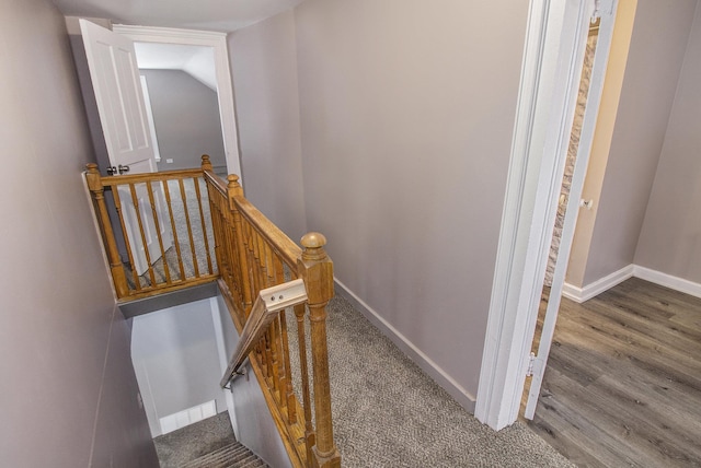 stairs featuring vaulted ceiling