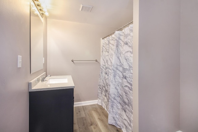 bathroom featuring hardwood / wood-style floors and vanity