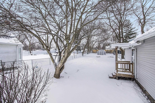 view of yard covered in snow