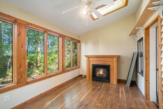 unfurnished living room featuring lofted ceiling, ceiling fan, and dark hardwood / wood-style floors