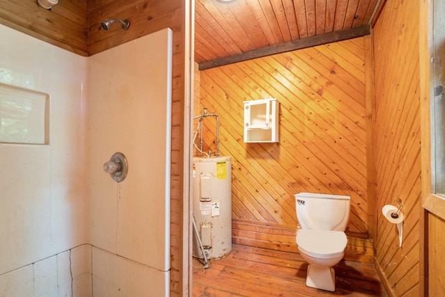 bathroom featuring hardwood / wood-style floors, wooden walls, electric water heater, toilet, and wooden ceiling