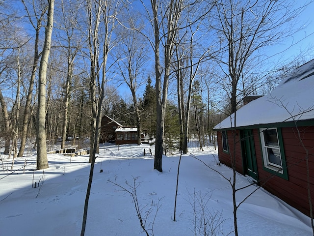 view of yard covered in snow