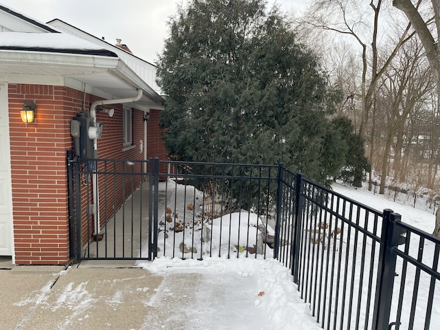 view of snow covered gate