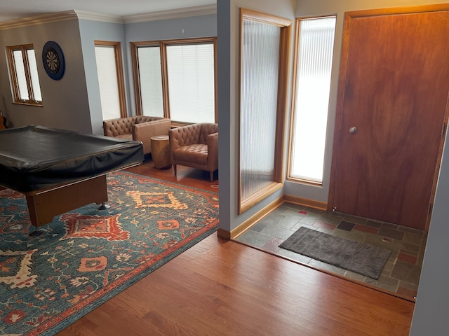 playroom with ornamental molding, a healthy amount of sunlight, wood-type flooring, and billiards