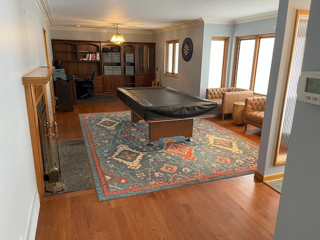 rec room with billiards, crown molding, and hardwood / wood-style floors