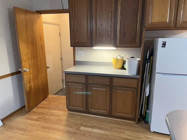 kitchen featuring white fridge and light wood-type flooring