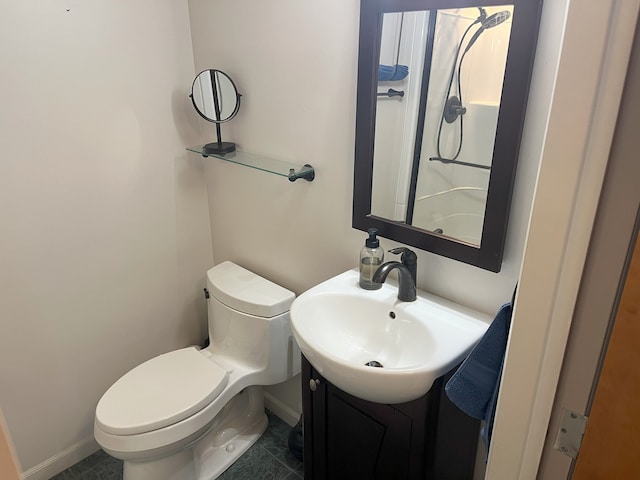 bathroom featuring toilet, tile patterned flooring, and vanity