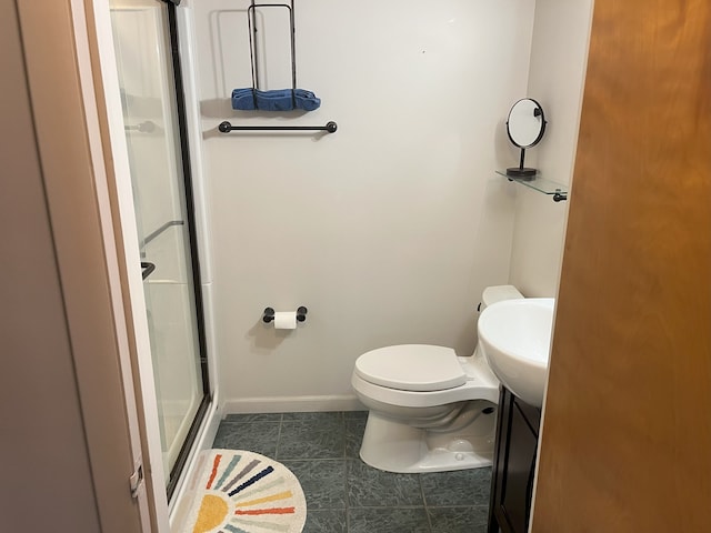 bathroom with toilet, walk in shower, and vanity