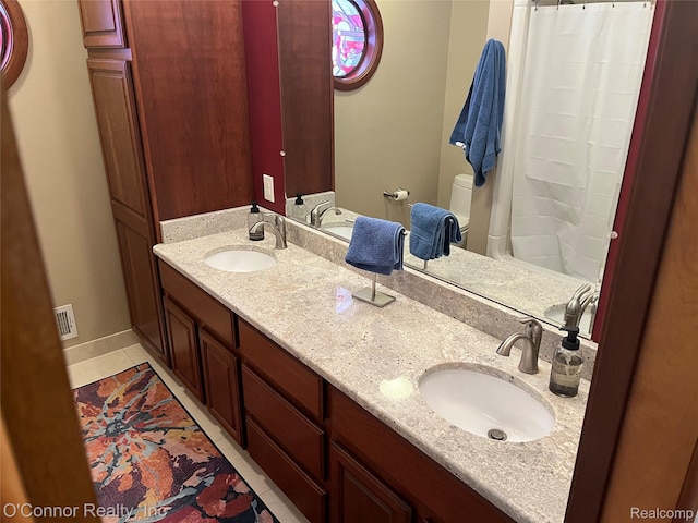 43 W Breitmeyer, Mount Clemens, MI 48043 - bathroom featuring double vanity, tile patterned floors, baseboards, and toilet