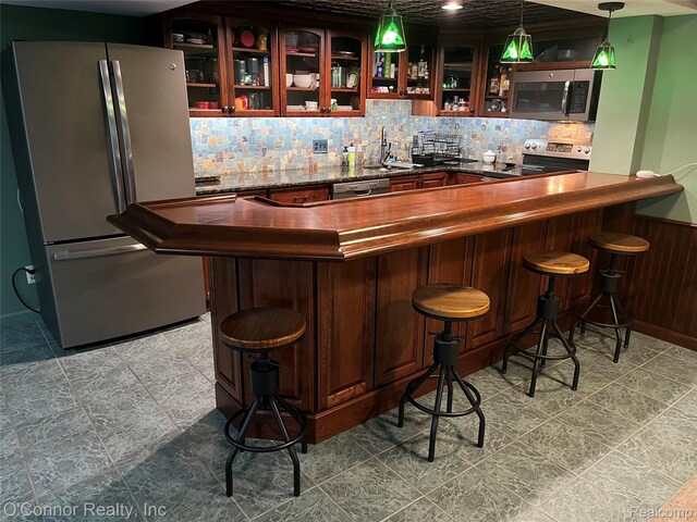 43 W Breitmeyer, Mount Clemens, MI 48043 - bar featuring stainless steel appliances, backsplash, a sink, and pendant lighting