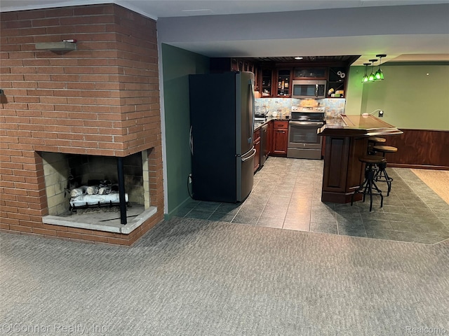 43 W Breitmeyer, Mount Clemens, MI 48043 - kitchen featuring appliances with stainless steel finishes, a breakfast bar area, glass insert cabinets, and light carpet