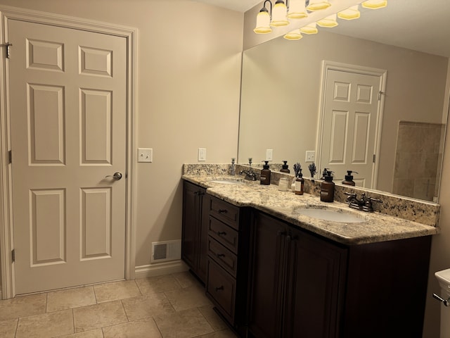 bathroom featuring tile patterned floors and vanity