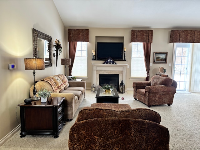 carpeted living room with vaulted ceiling