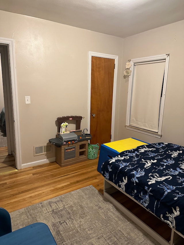 bedroom featuring hardwood / wood-style floors