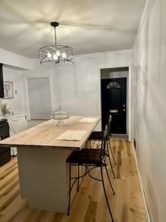 dining room featuring a chandelier and light hardwood / wood-style flooring