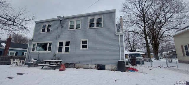 view of snow covered house