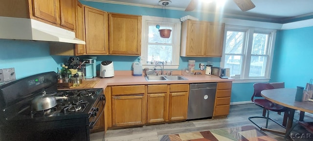 kitchen featuring sink, black range with gas stovetop, light wood-type flooring, stainless steel dishwasher, and crown molding