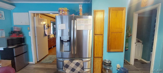 kitchen featuring appliances with stainless steel finishes and ornamental molding