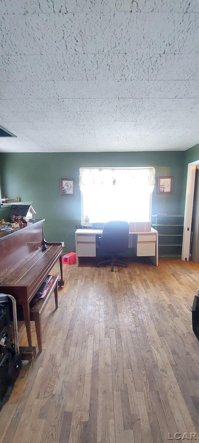 miscellaneous room with hardwood / wood-style flooring