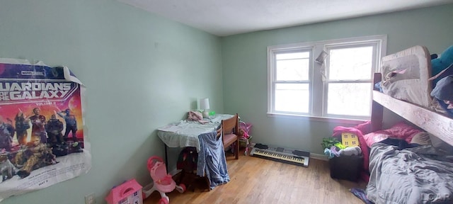 bedroom with light wood-type flooring