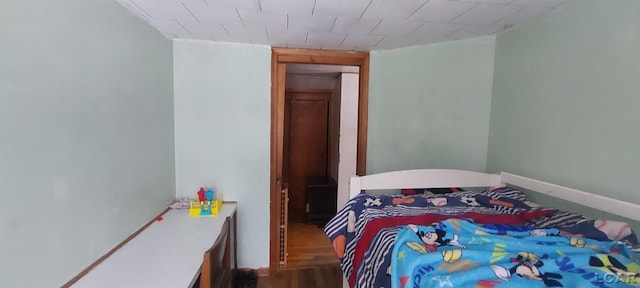 bedroom featuring wood-type flooring