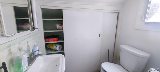 bathroom featuring sink and toilet