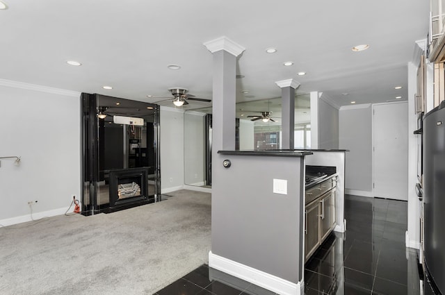 8200 E Jefferson Ave Unit 1811, Detroit, MI 48214 - kitchen with kitchen peninsula, ceiling fan, ornate columns, dark colored carpet, and ornamental molding