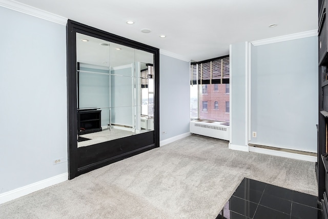 8200 E Jefferson Ave Unit 1811, Detroit, MI 48214 - interior space featuring baseboard heating, radiator, ornamental molding, and carpet flooring