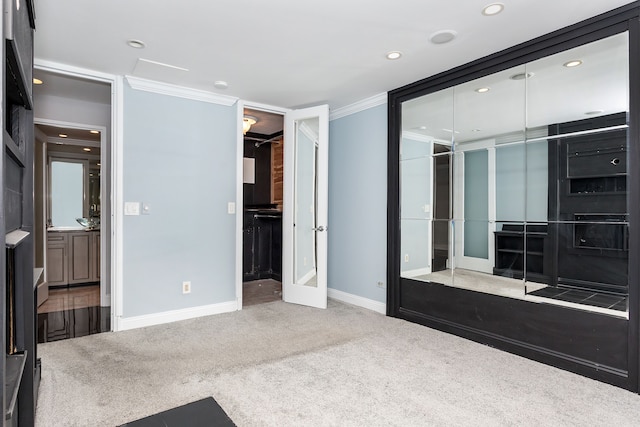 8200 E Jefferson Ave Unit 1811, Detroit, MI 48214 - carpeted bedroom with a closet, french doors, and crown molding